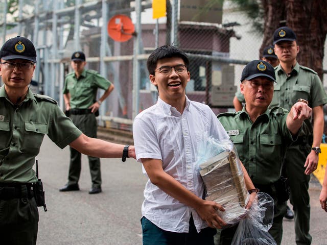 Hong Kong democracy activist Joshua Wong leaves Lai Chi Kok Correctional Institute in Hong Kong on Monday