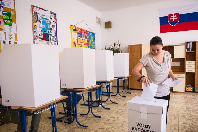 A woman casts her ballot at a polling station in Bratislava during the European Elections.