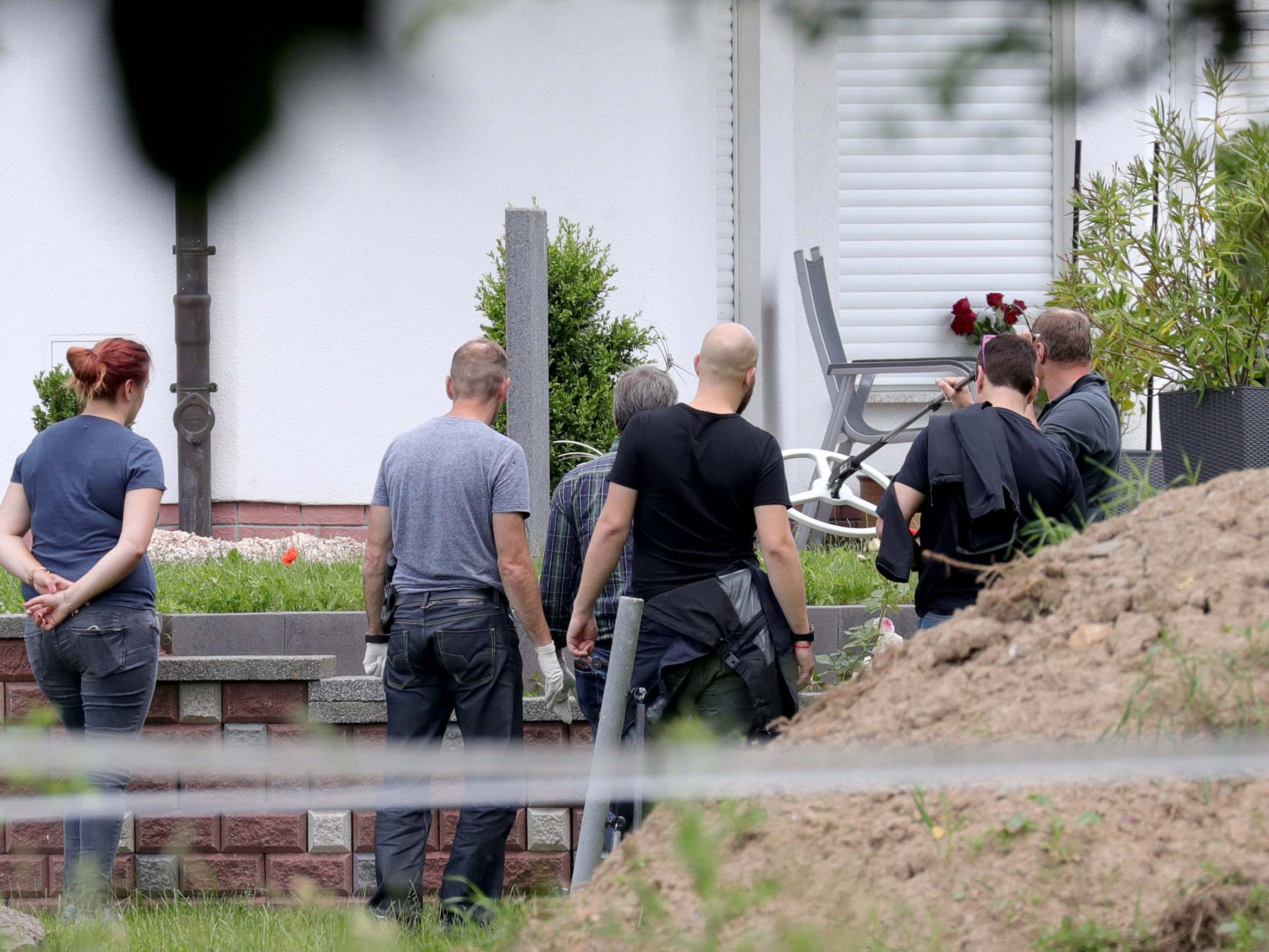 Police search the grounds of Walter Luebcke's home in Kassel