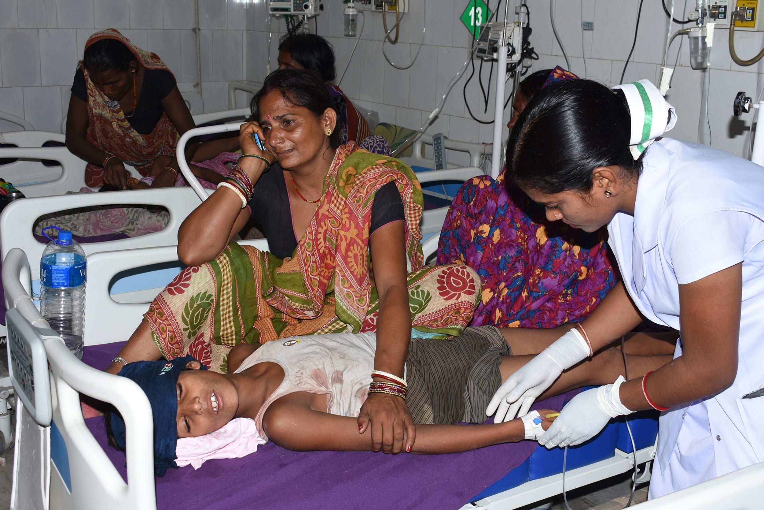 An Indian child receives medical treatment due to Acute Encephalitis Syndrome (AES) in a hospital in Muzaffarpur following month-long lychee harvesting season