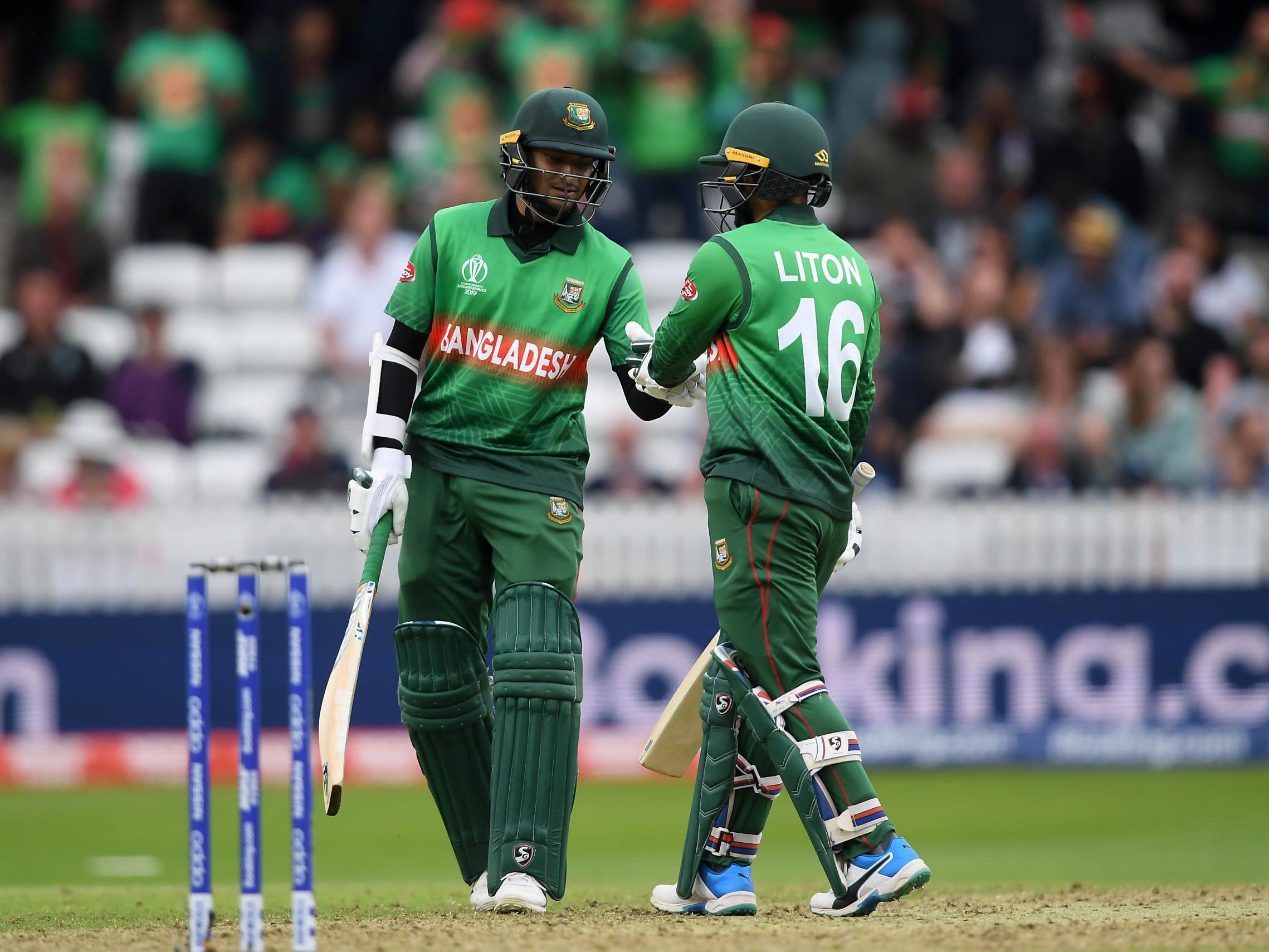 Liton Das and Shakib Al Hasan congratulate one another after securing victory