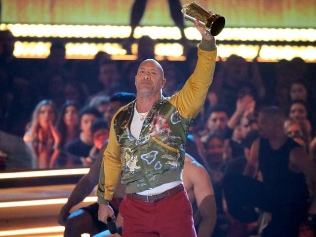 Dwayne 'The Rock' Johnson holds up his Generation Award at the MTV Awards 2019