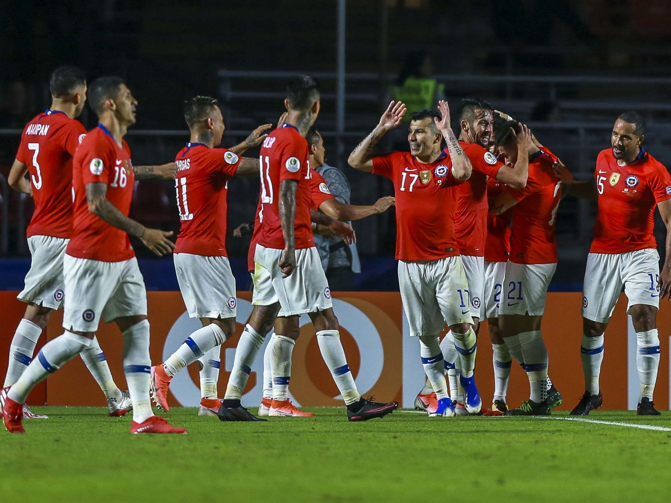 Chile celebrate their 4-0 victory over Japan as they began their Copa America defence in style