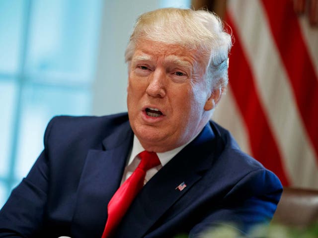 Donald Trump speaks during a meeting in the Cabinet Room of the White House