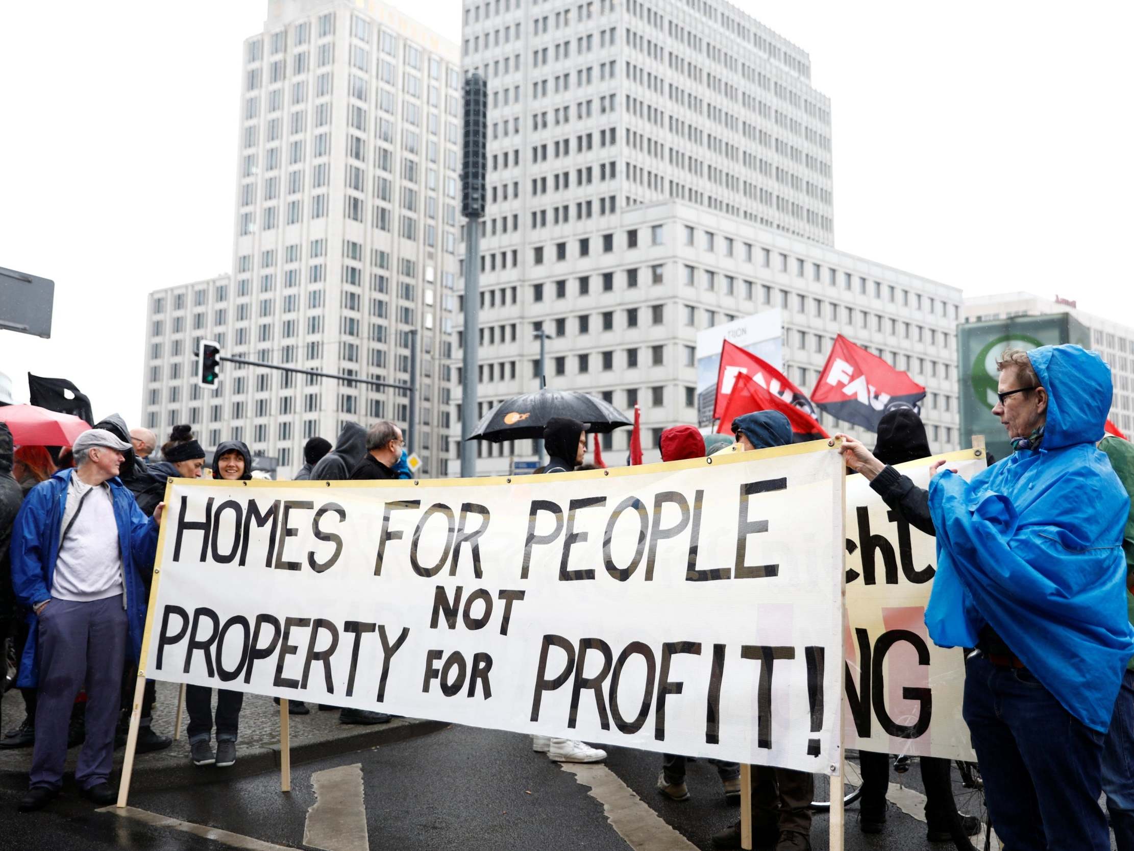 Protesters hold a banner during a 2018 demonstration against rising rents