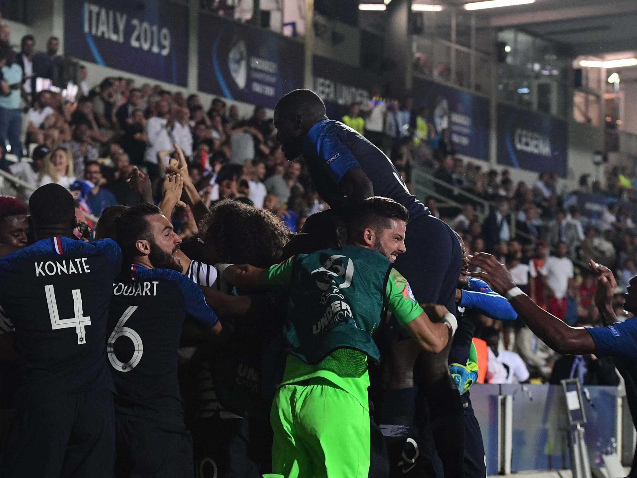 France's players celebrate after England scored an own goal during their Group C match