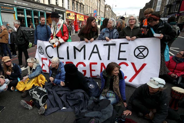 Climate change protesters from Extinction Rebellion Scotland, lying down on Lothian Road, Edinburgh.