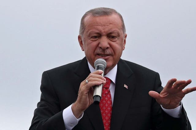 Turkish President Recep Tayyip Erdogan speaks during an AK Party (AKP) local election campaign rally in Istanbul