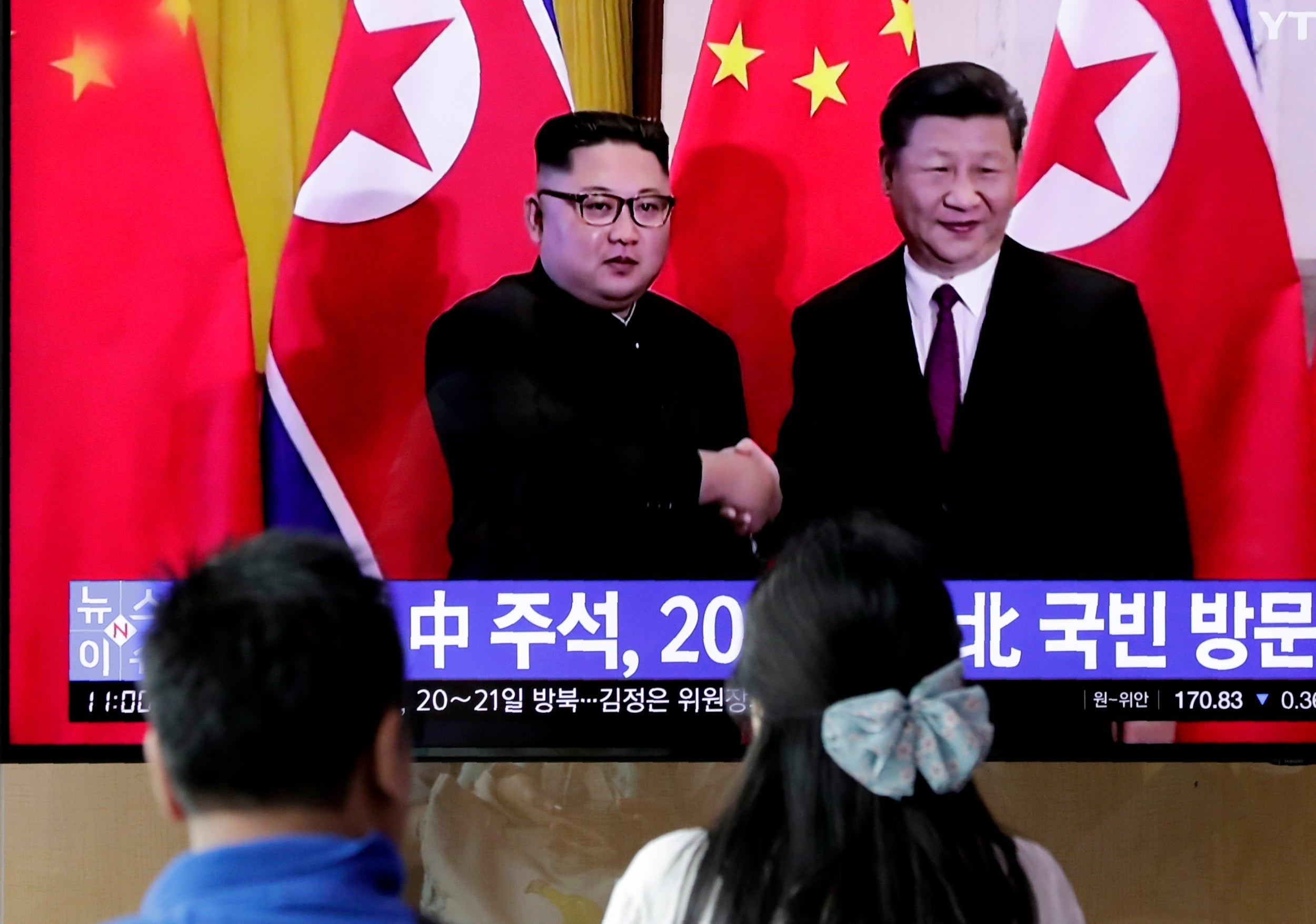 Members of public in Seoul watch reports of Chinese President Xi Jinping's imminent state visit to North Korea