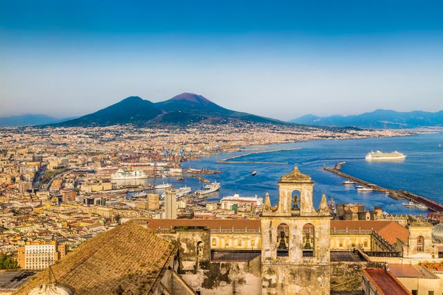 The city sits in a bay overlooking the active volcano Vesuvius