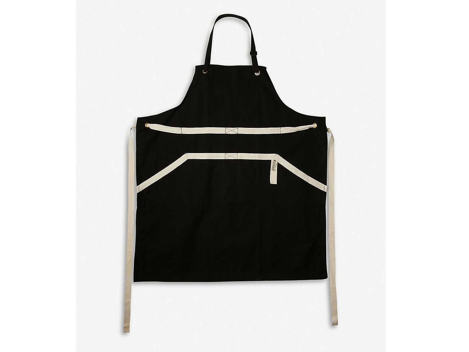 This apron from Le Creuset has a front pocket to keep your phone safe and splash-free while you’re manning the grill (