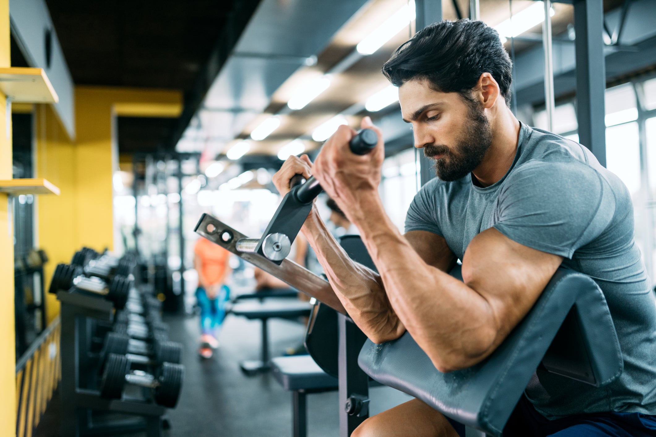 Bodybuilder in a Hood in the Gym