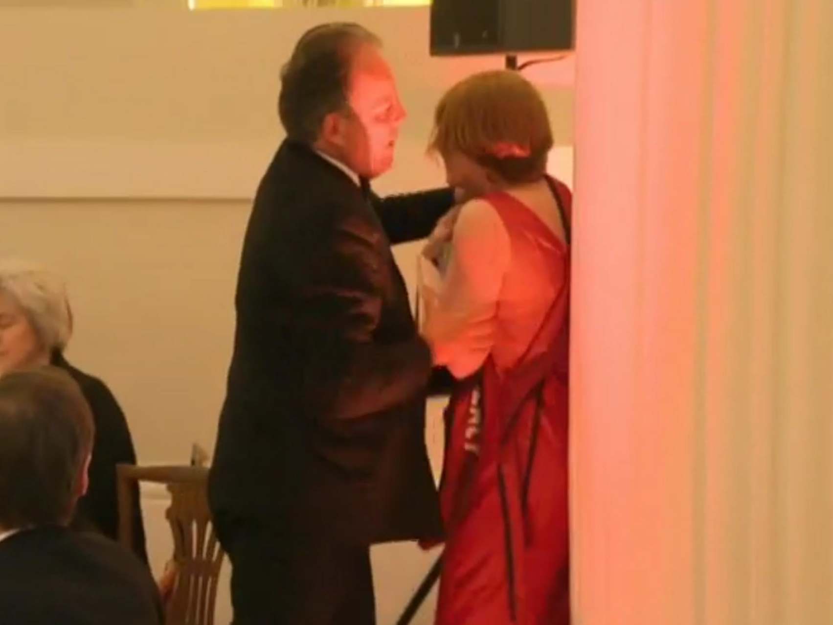 Video shows Mark Field grabbing protester around the neck area before pushing her out of the Mansion House dinner