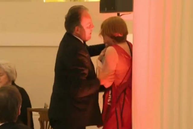 Video shows Mark Field grabbing protester around the neck area before pushing her out of the Mansion House dinner