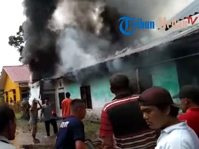 Still image taken from a Tribun-Medan.com video of a fatal fire at a makeshift matchstick factory in the North Sumatra province of Indonesia on 21 June 2019.