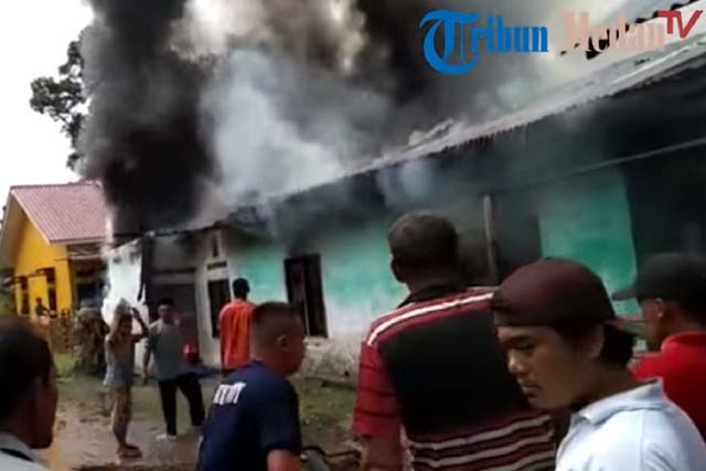 Still image taken from a Tribun-Medan.com video of a fatal fire at a makeshift matchstick factory in the North Sumatra province of Indonesia on 21 June 2019.