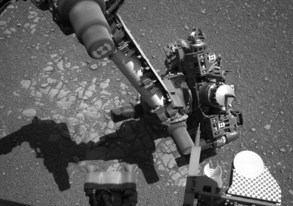 The image from Curiosity's left navcam at the same time shows the craft was attempting to take a self-portrait over the Martian terrain
