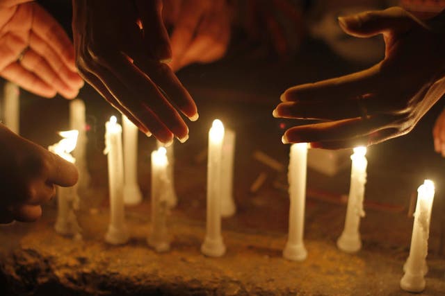 Candles are lit in Pakistan as part of peaceful gathering to end violence against women