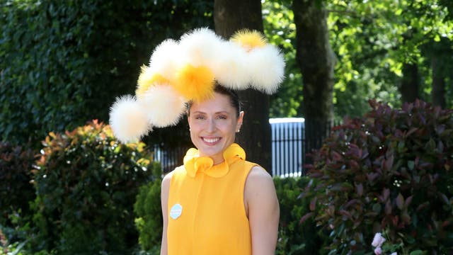 Summer arrives in the form of Valerie Stark on the fifth day of Royal Ascot. The entrepreneur makes a statement in a dandelion yellow chiffon dress and pom-pom headpiece.