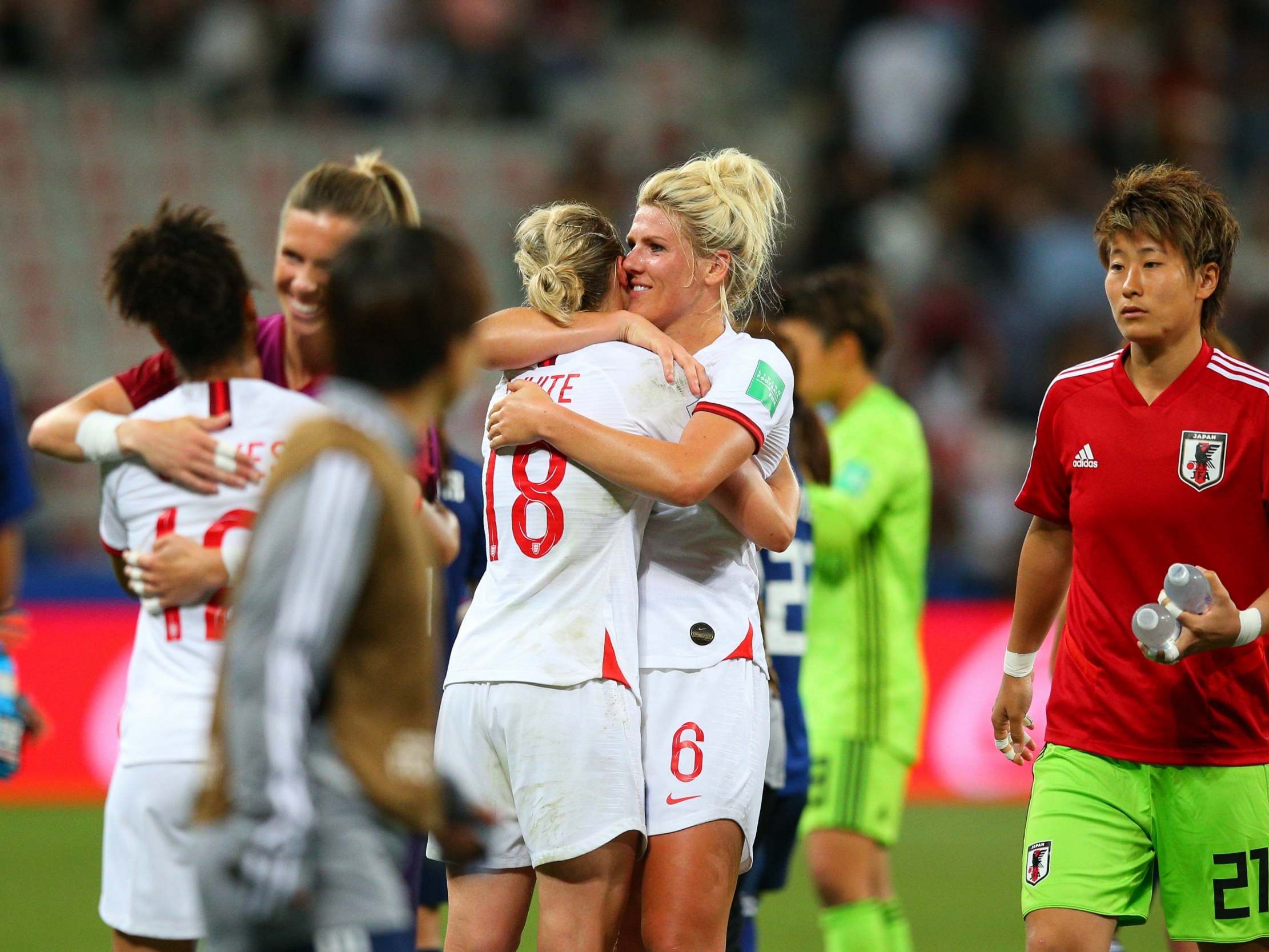 England celebrate defeating Japan in their final group game