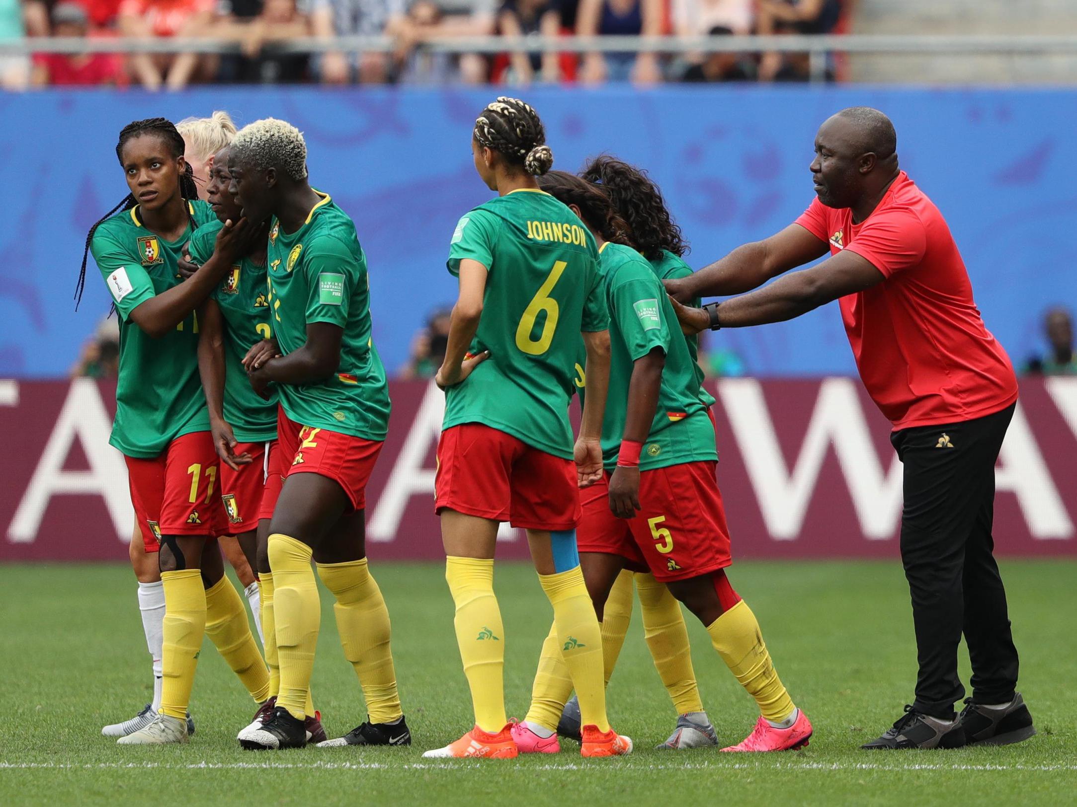 Alain Djeumfa consoles his players during their defeat to England