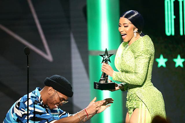 Anderson .Paak presents Cardi B with the award for Album of the Year