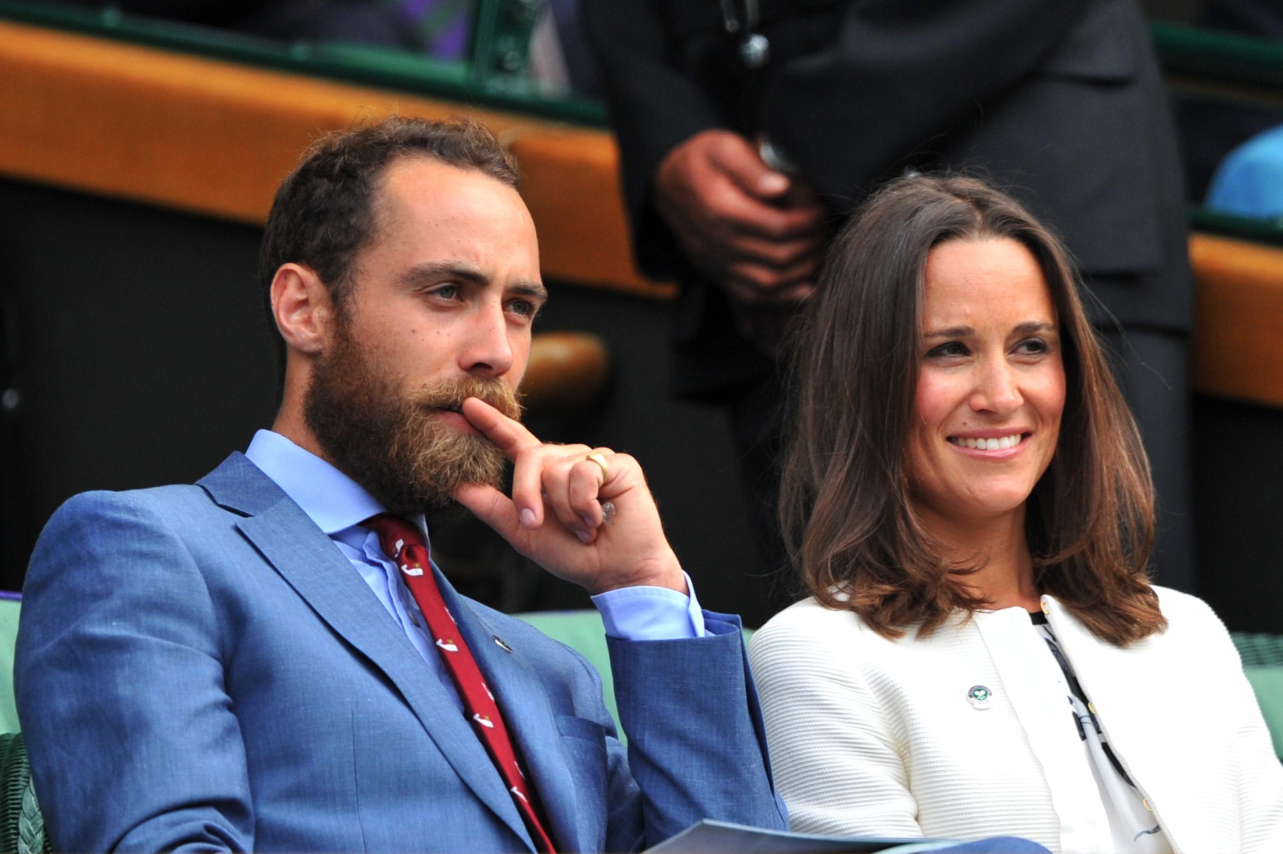 Pippa Middleton (R) and James Middleton (L), sister and brother of Catherine, Duchess of Cambridge, sit together in the Royal Box on Centre Court on day four of the 2014 Wimbledon Championships at The All England Tennis Club in Wimbledon, southwest London, on June 26, 2014.