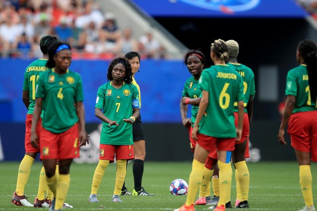 Cameroon's players react after a VAR decision goes against them
