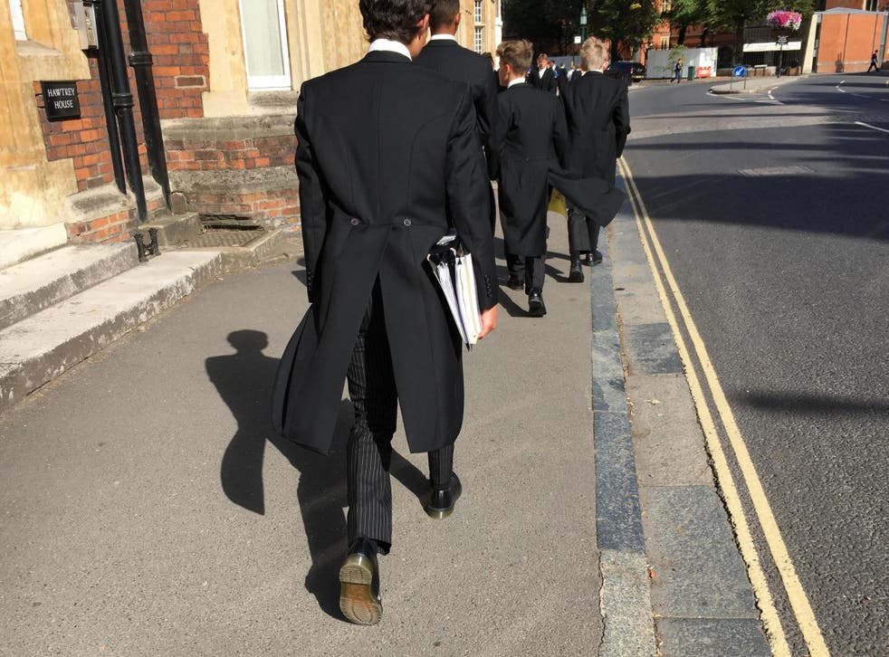 Etonian schoolboys in their traditional uniform of tails; the college would be axed if activists won their campaign