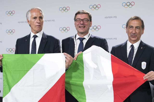 Italian delegates pose at the IOC session in Lausanne