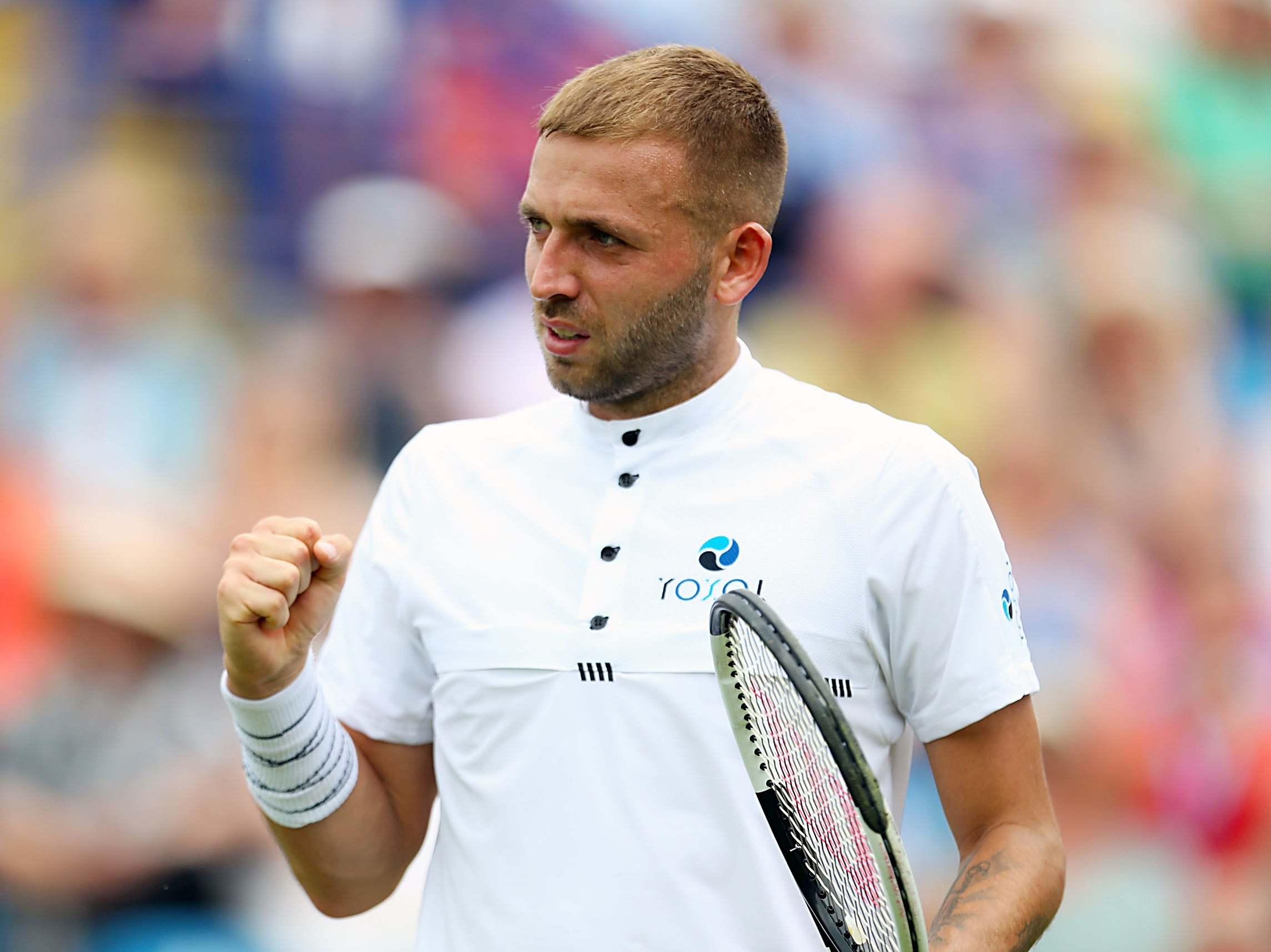 Dan Evans celebrates defeating Radu Albot