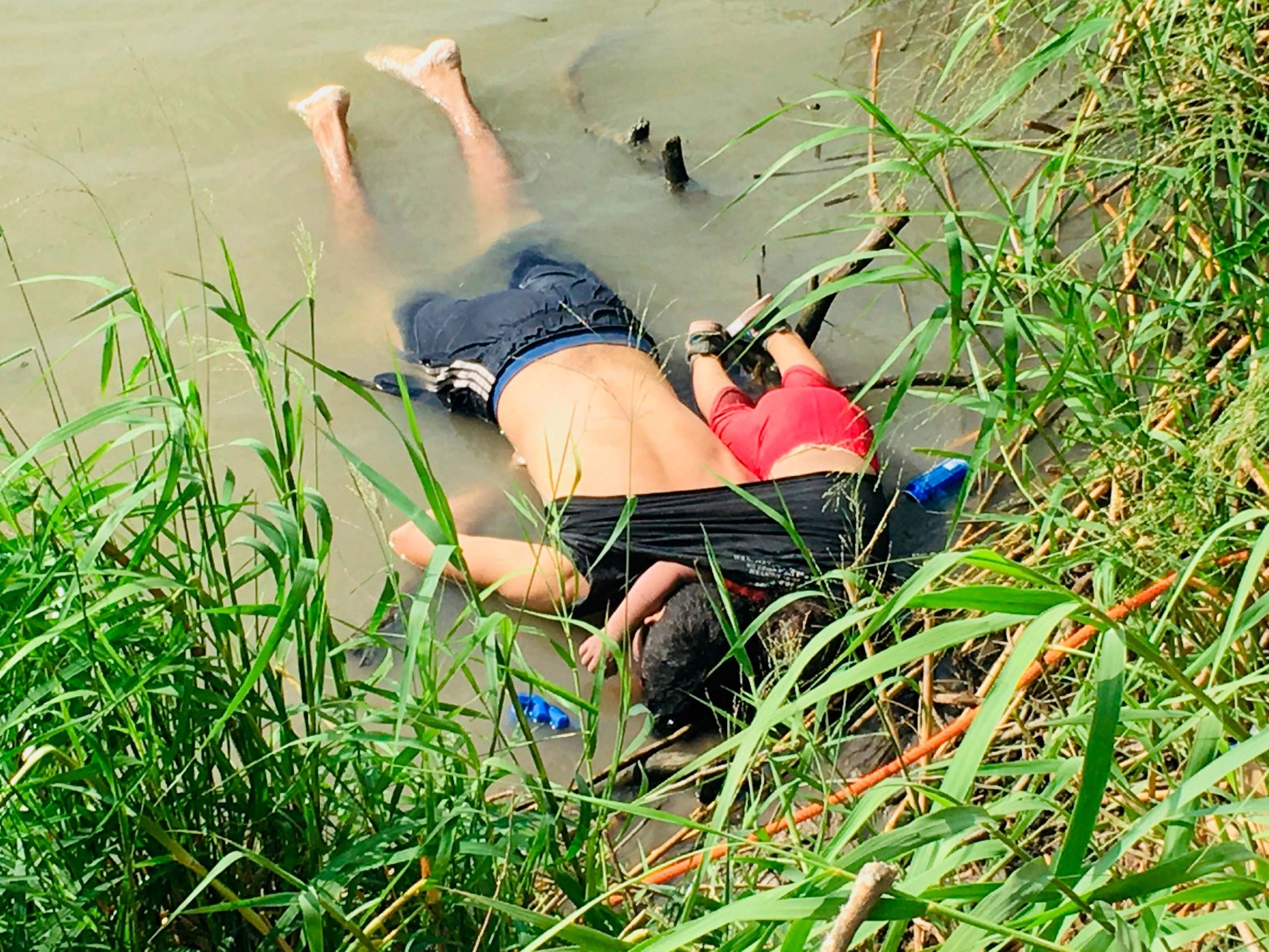 The bodies of a man and his one-year-old daughter on the bank of the Rio Grande