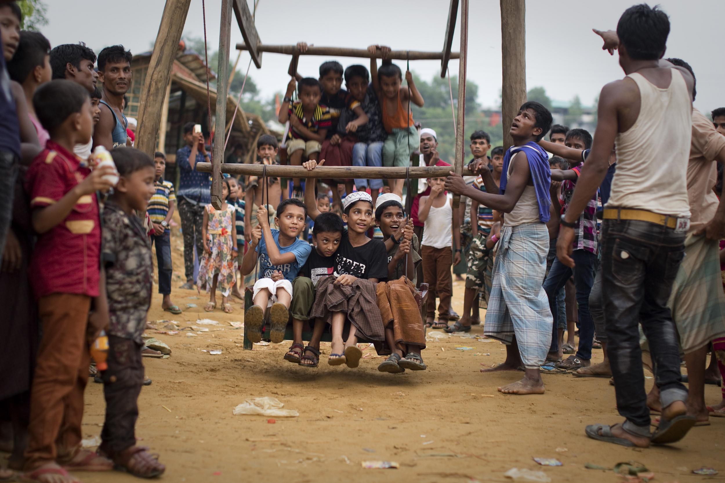 Children enjoy a ride on a homemade ferris wheel during Eid al-Ftr in Cox's Bazar, Bangladesh. They are celebrating the holiday in Balukhali, a Rohingya refugee camp sheltering over 800,000 people. The camp is one of the largest in the world, and is bracing for the onset of the monsoon rains.
