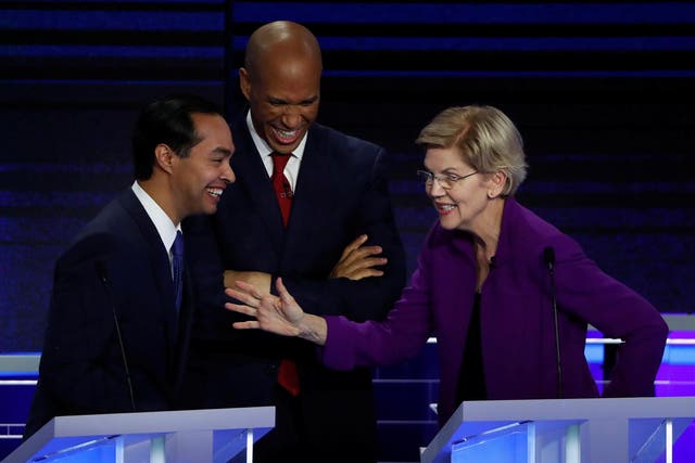 Julian Castro, Cory Booker and Elizabeth Warren talk during a break at the first 2020 presidential election Democratic candidates debate