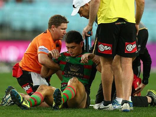 National Rugby League player Kyle Turner is helped off the field after suffering a concussion
