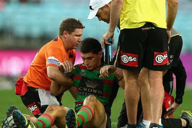 National Rugby League player Kyle Turner is helped off the field after suffering a concussion