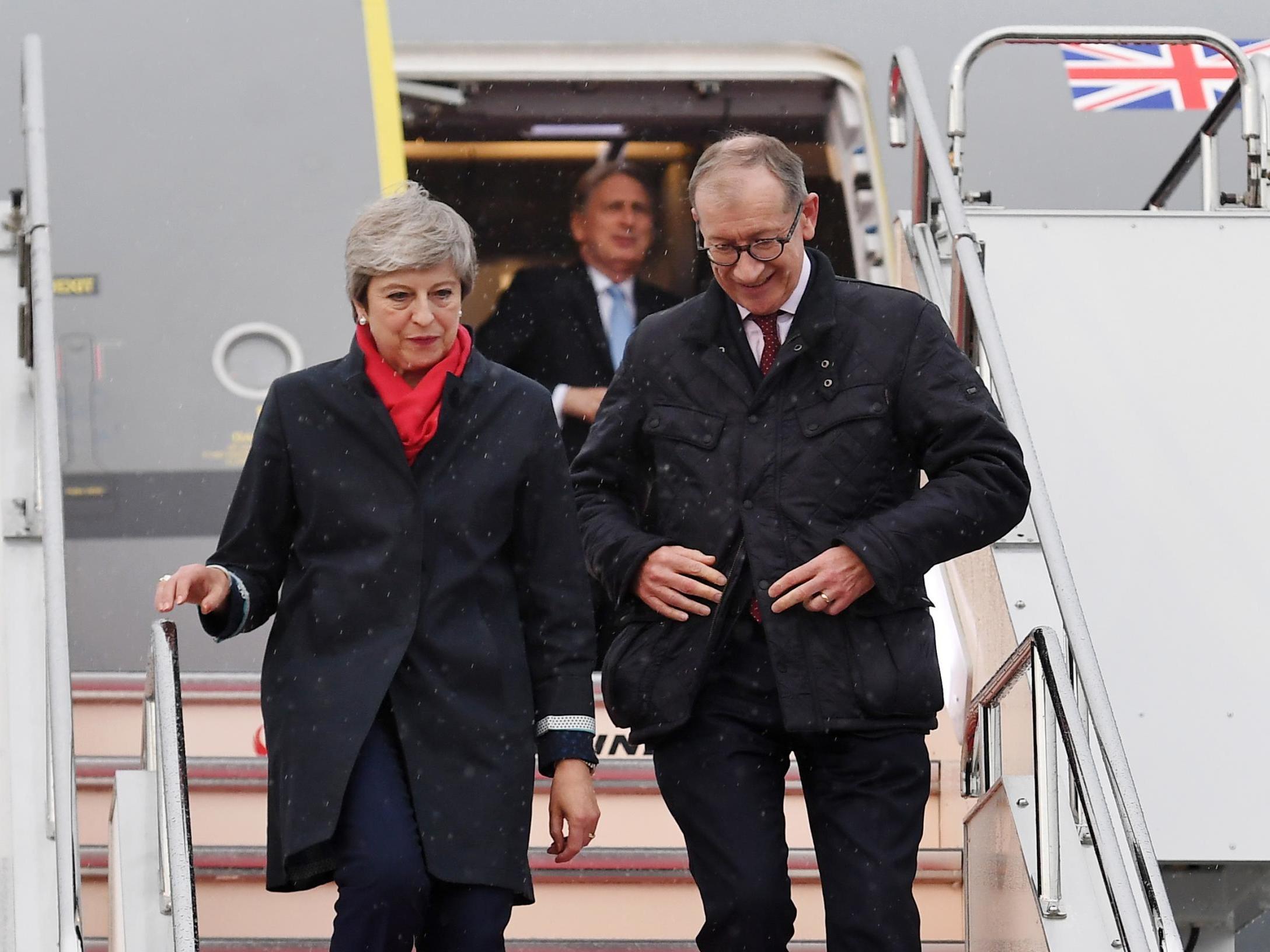 Theresa May arrives with her husband Philip May in Osaka, where she is expected to hold bilateral talks with Vladimir Putin