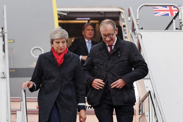 Theresa May arrives with her husband Philip May in Osaka, where she is expected to hold bilateral talks with Vladimir Putin