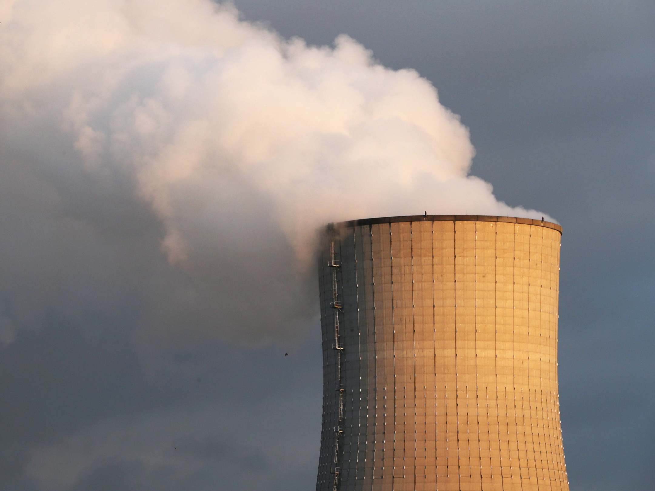Smoke billows from a chimney at a combined-cycle gas turbine power plant