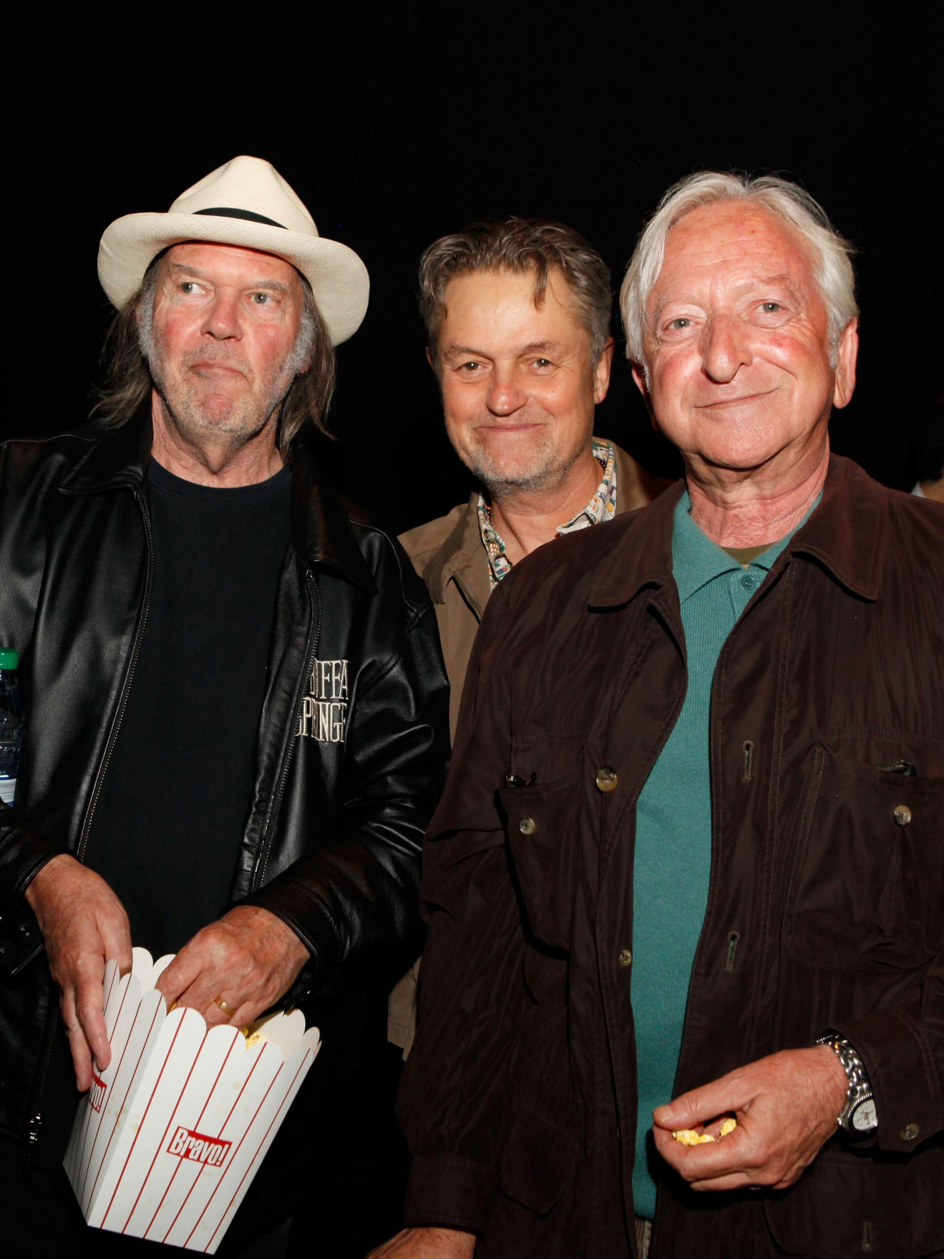 Roberts (right) with Neil Young and film director Jonathan Demme