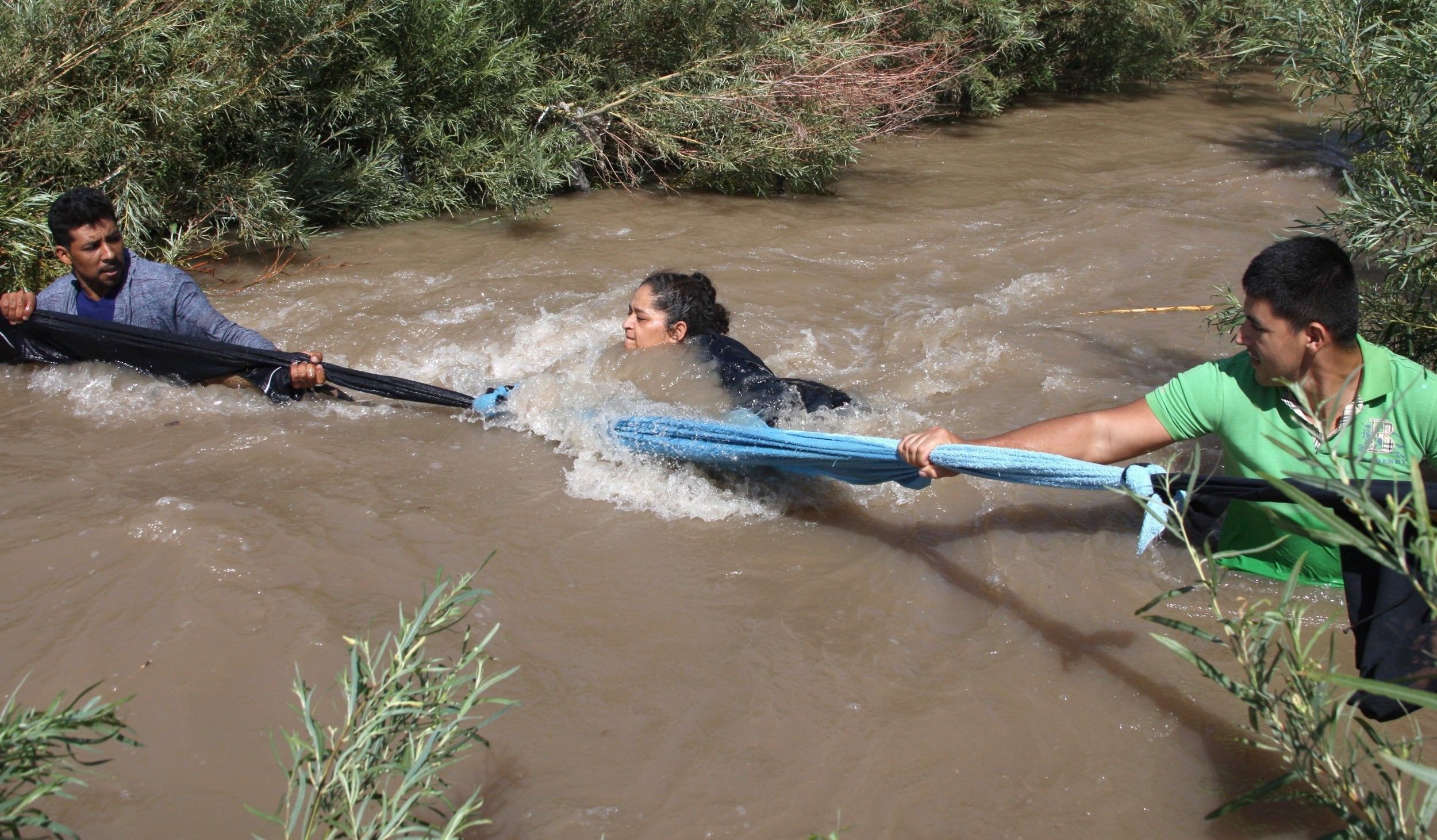 Central American migrants cross the Rio Grande on 11 June 2019