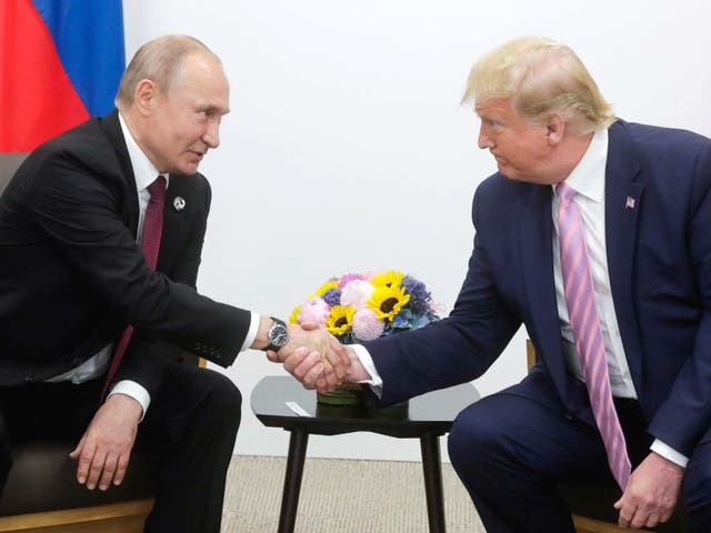 Vladimir Putin and Donald Trump shake hands at the G20 summit in Osaka, Japan