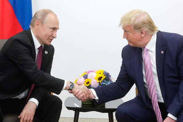 Vladimir Putin and Donald Trump shake hands at the G20 summit in Osaka, Japan