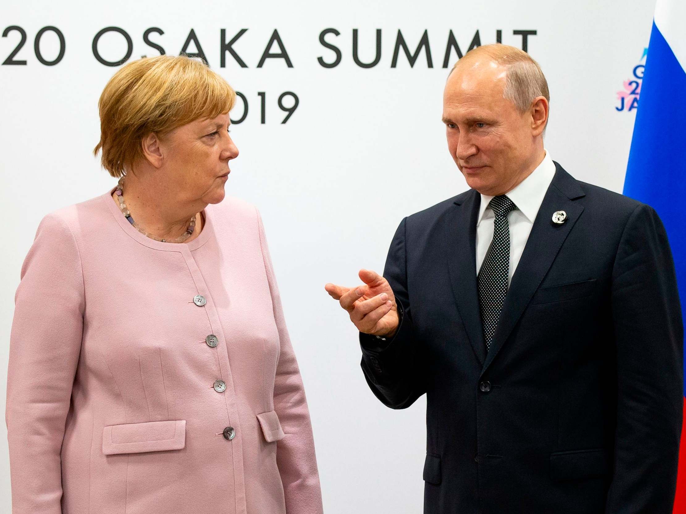 Angela Merkel chats to Russian president Vladimir Putin at the G20 Summit in Osaka