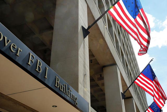 US flags fly outside the FBI headquarters in Washington DC