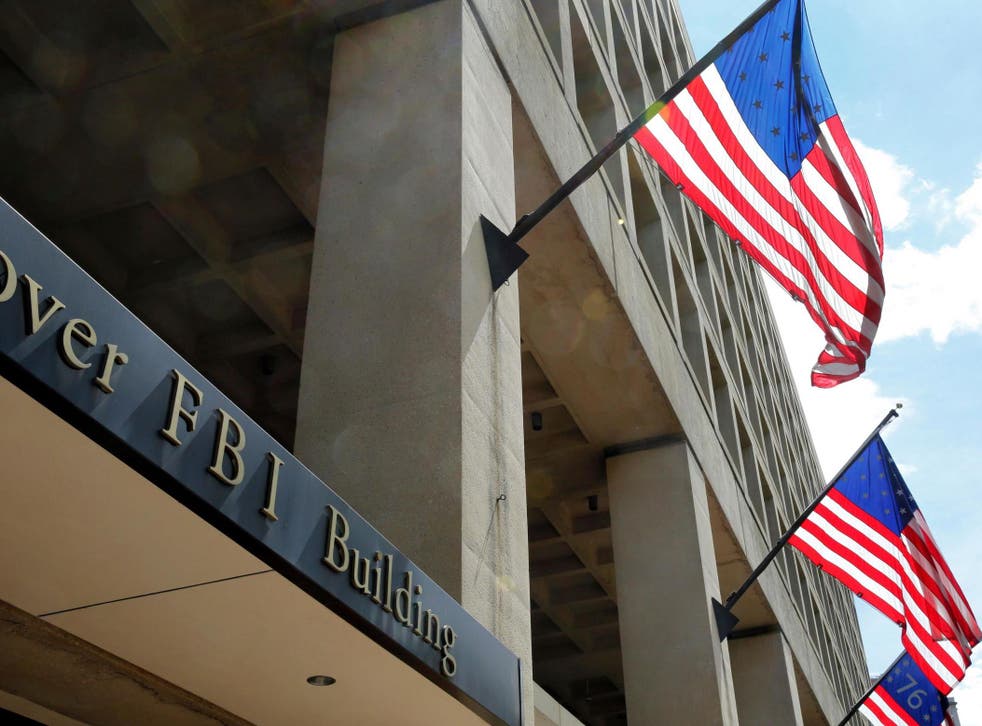 US flags fly outside the FBI headquarters in Washington DC