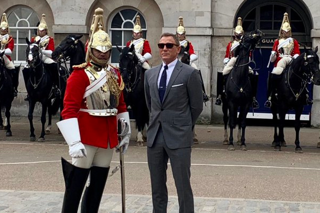 Daniel Craig poses with the Royal Household Cavalry this weekend.