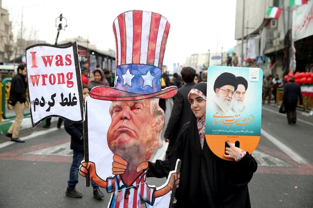 Iranian woman holds an effigy of US president Donald Trump during a rally in Tehran