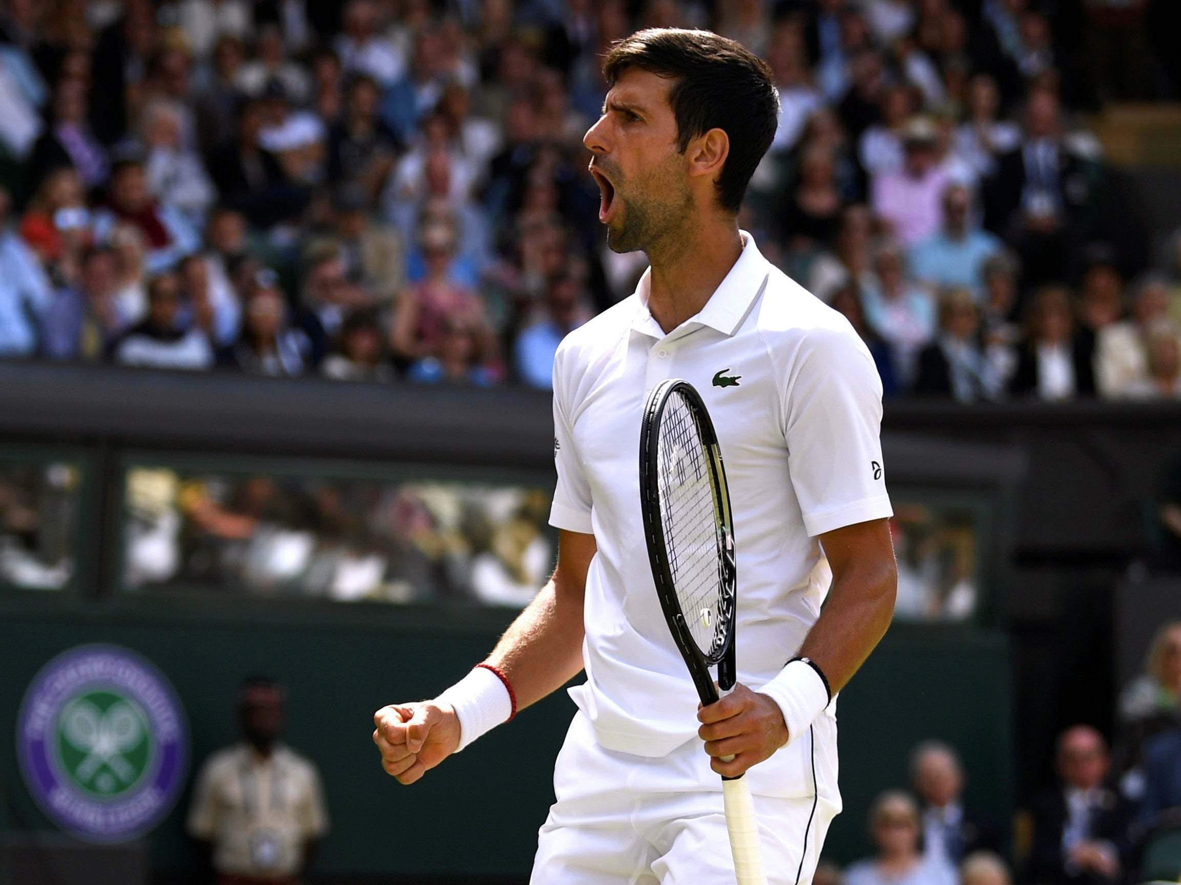 Serbia's Novak Djokovic reacts during his first round match