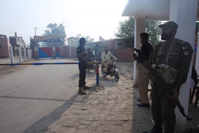 Pakistani paramilitary troopers patrol outside a central jail in Multan. Muhammad Ajmal has been charged with the murder of nine of his relatives